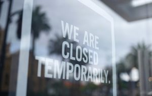 Image of shop window stating "We Are Closed Temporarily"