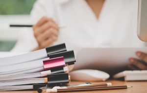 Images shows someone doing paperwork. Get ready for your TPAR Businesses who make payments to contractors may need to report these payments and lodge a Taxable payments annual report (TPAR).
